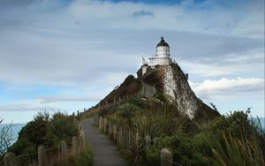 Preview wallpaper lighthouse, tower, road, hill, landscape