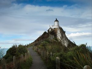Preview wallpaper lighthouse, tower, road, hill, landscape