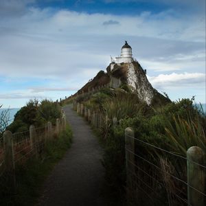 Preview wallpaper lighthouse, tower, road, hill, landscape