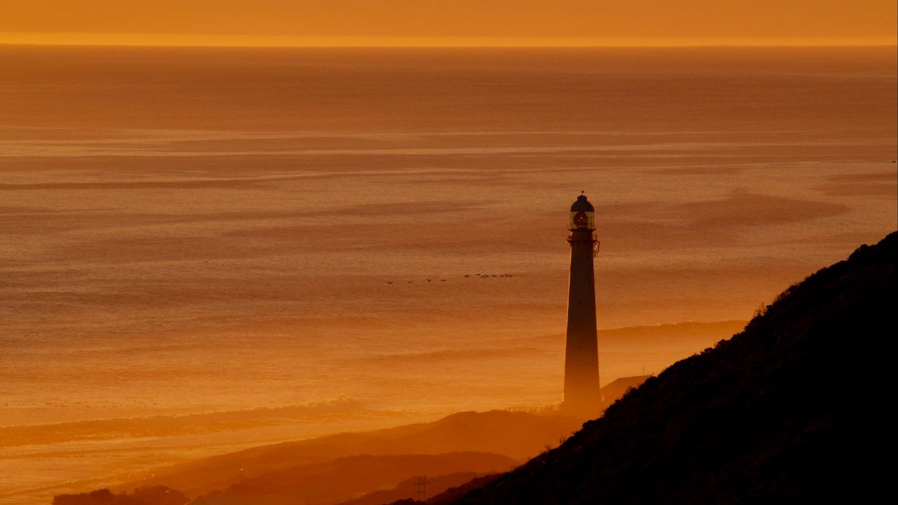 Wallpaper lighthouse, tower, sea, mountains, sunset, dark