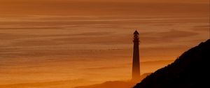 Preview wallpaper lighthouse, tower, sea, mountains, sunset, dark