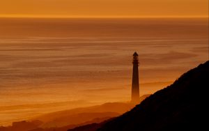 Preview wallpaper lighthouse, tower, sea, mountains, sunset, dark