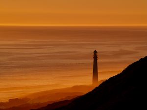 Preview wallpaper lighthouse, tower, sea, mountains, sunset, dark