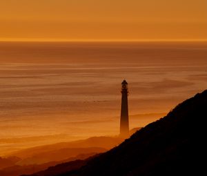 Preview wallpaper lighthouse, tower, sea, mountains, sunset, dark