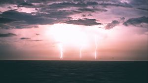 Preview wallpaper lightning, horizon, sea, night, clouds, overcast
