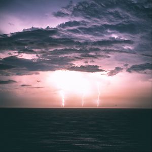 Preview wallpaper lightning, horizon, sea, night, clouds, overcast