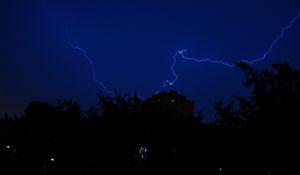 Preview wallpaper lightning, night, overcast, sky, trees