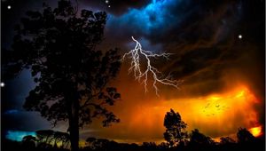 Preview wallpaper lightning, sky, trees, outlines, stars, bad weather, night, orange, birds