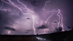 Preview wallpaper lightning, thunderstorm, road, field