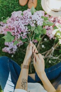 Preview wallpaper lilac, flowers, girl, hands, tattoo