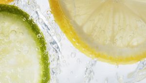 Preview wallpaper lime, lemon, water, drops, immersion