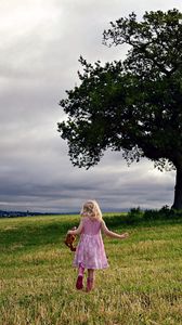 Preview wallpaper little girl, field, tree, mood