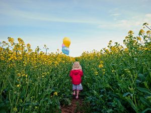 Preview wallpaper little girl, meadow, mood, balloons