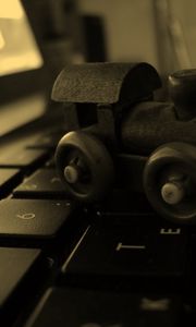 Preview wallpaper locomotive, keyboard, surface, notebook, toy