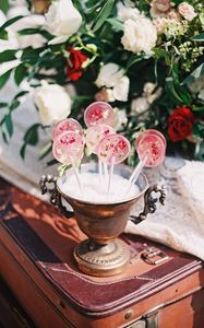 Preview wallpaper lollipops, candy, pink, flowers, cup