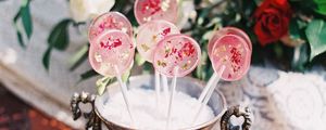 Preview wallpaper lollipops, candy, pink, flowers, cup