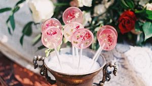 Preview wallpaper lollipops, candy, pink, flowers, cup