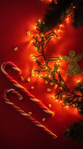 Preview wallpaper lollipops, garland, angel, figurine, gold, holiday