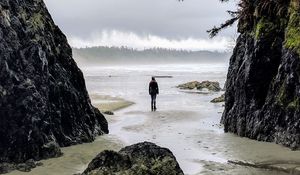 Preview wallpaper loneliness, alone, man, rocks, coast