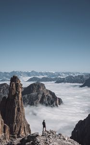 Preview wallpaper loneliness, alone, man, rocks, clouds