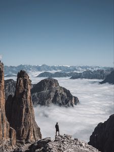 Preview wallpaper loneliness, alone, man, rocks, clouds