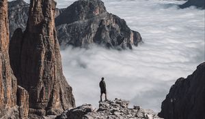 Preview wallpaper loneliness, alone, man, rocks, clouds