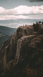 Preview wallpaper loneliness, alone, rock, mountains, sky