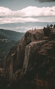 Preview wallpaper loneliness, alone, rock, mountains, sky