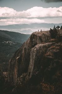 Preview wallpaper loneliness, alone, rock, mountains, sky