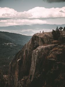 Preview wallpaper loneliness, alone, rock, mountains, sky