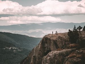 Preview wallpaper loneliness, alone, rock, mountains, sky