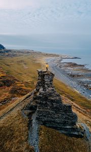 Preview wallpaper loneliness, alone, rock, coast, sea, sky