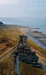 Preview wallpaper loneliness, alone, rock, coast, sea, sky