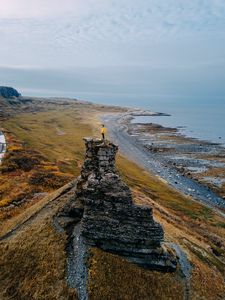 Preview wallpaper loneliness, alone, rock, coast, sea, sky