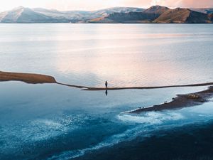 Preview wallpaper loneliness, alone, sea, mountains, sky