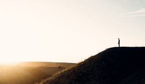 Preview wallpaper loneliness, alone, silhouette, slope, sky