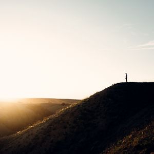 Preview wallpaper loneliness, alone, silhouette, slope, sky