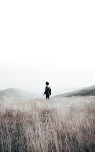 Preview wallpaper loneliness, field, hat, man