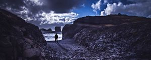 Preview wallpaper loneliness, rocks, man, shore, sea, stones