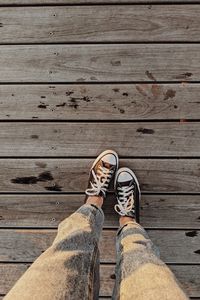 Preview wallpaper loneliness, sneakers, legs, wooden