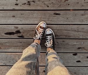 Preview wallpaper loneliness, sneakers, legs, wooden