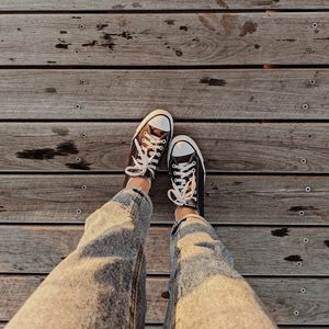 Preview wallpaper loneliness, sneakers, legs, wooden