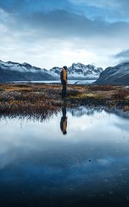 Preview wallpaper lonely, loneliness, mountains, grass, reflection