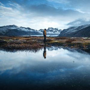 Preview wallpaper lonely, loneliness, mountains, grass, reflection