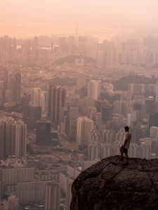 Preview wallpaper lonely, loneliness, rock, city