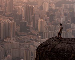Preview wallpaper lonely, loneliness, rock, city