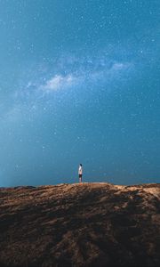 Preview wallpaper lonely, loneliness, starry sky, rocks
