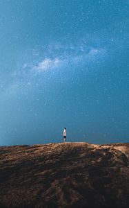 Preview wallpaper lonely, loneliness, starry sky, rocks