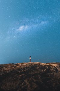 Preview wallpaper lonely, loneliness, starry sky, rocks