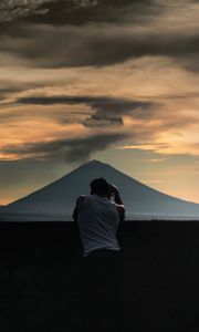 Preview wallpaper lonely, photographer, silhouette, mountain